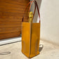 MANALI DESIGN-GERALDINE BREMER WEILL-PORTE BOUTEILLE-100%CUIR-JAUNE-BANDA